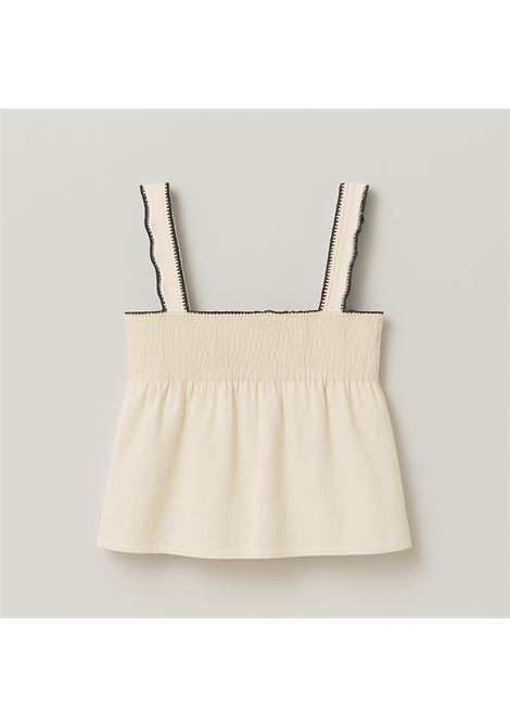 Ivory smock top in lightweight fabric with wide straps and contrasting black wavy edges. Perfect for cool, feminine summer looks. Nekane |  | MANDISAIVORY